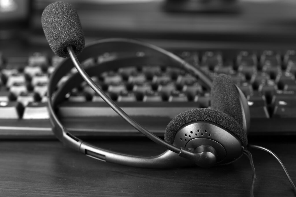 headphone-keyboard-closeup-wooden-desk-background-modified
